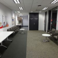 Waiting area with tables and chairs